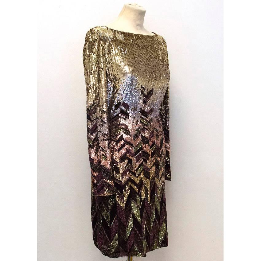 Matthew Williamson sequinned midi dress in a gold and plum directional pattern. The dress features a round neckline, long sleeves and is medium weight with a slim fit. Fully lined in plum with a concealed back zipper. Size US 4, UK 8.

Please kindly