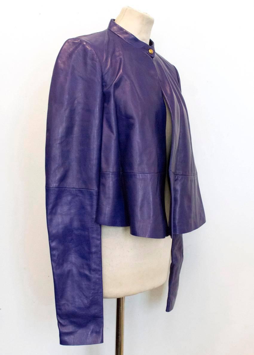 Vionnet purple fully lined leather bomber with a round neck, long sleeves, high neck single gold snap button closure, paneling detail on the back and a slightly lower back. Made in Italy. Size 40

Please note this item is missing a care label.