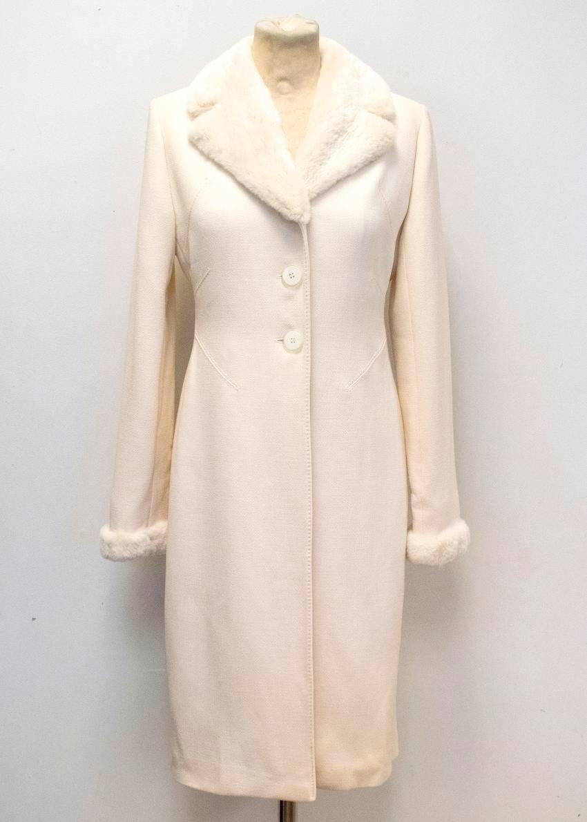 Valentino cream crepe coat with rabbit fur lapel & cuffs. 
- Made from 100% wool 
- Features detailed stitching on pleats
- Fur wide notch lapel and cuffs 
- Three button closure
- Long length 
- Heavy weight 

Please note this item does