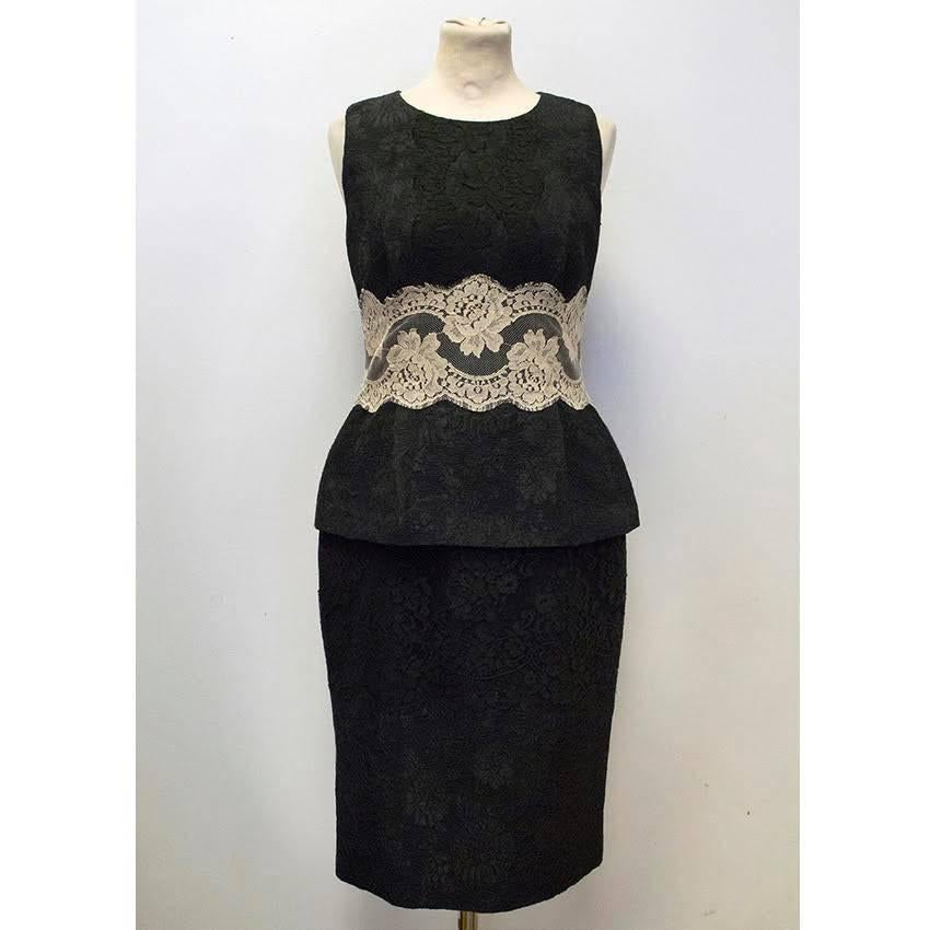 Dolce & Gabbana Black sleeveless Dress with a bateau neckline, peplum waist and contrasting cream lace detail on the waist. The dress is textured with a brocade pattern and slim fitting. Fully lined with a split at the back and a concealed back