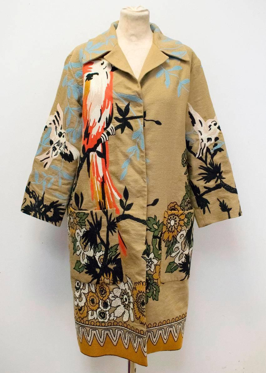 Etro camel brown long coat. Featuring multicolored floral and bird stitched embroidery all over the coat. The coat has a wide notch lapel, concealed buttons down the placket and side pockets.

Fabric	LINEN, WOOL

Condition -