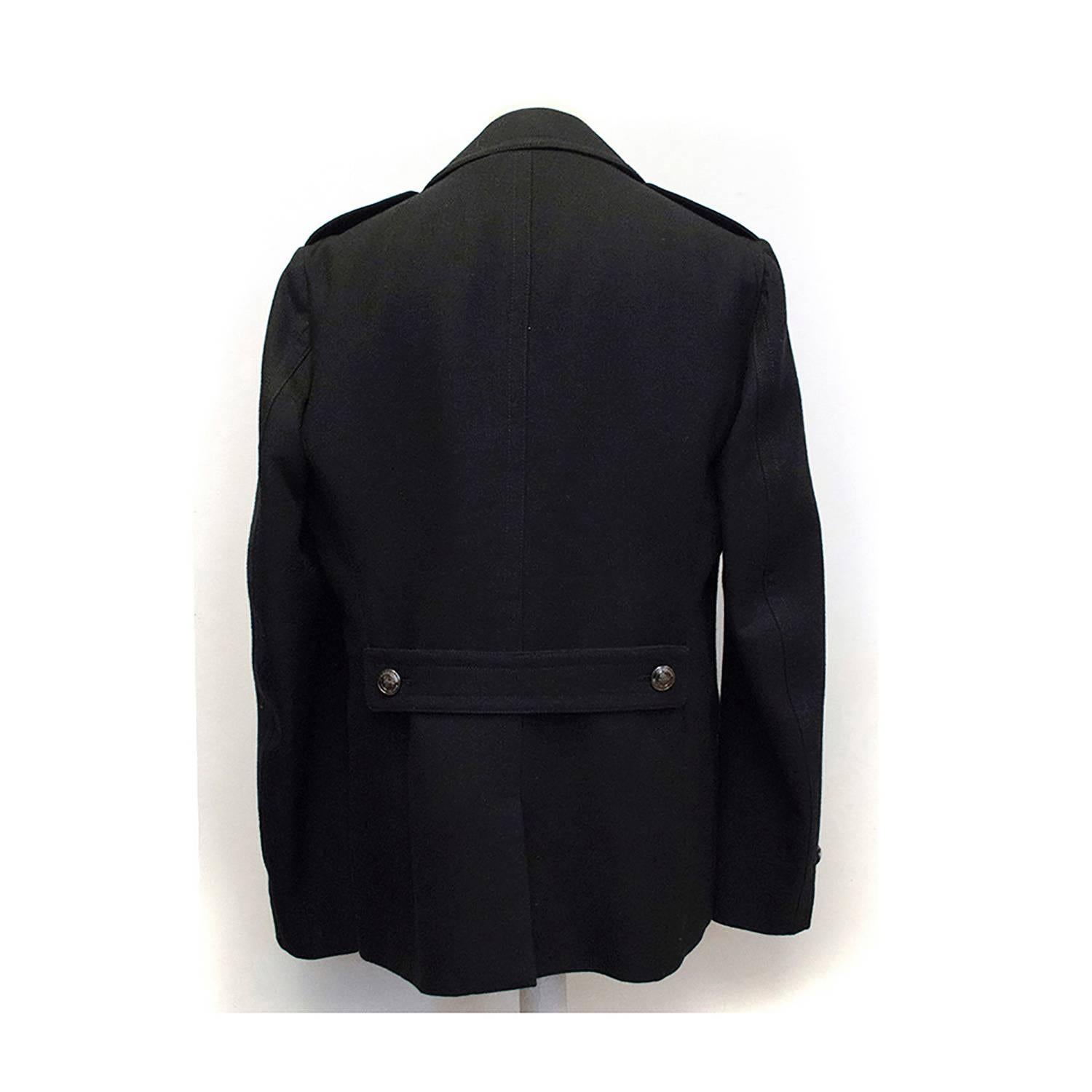 Burberry Black Double Breasted Coat. Hardly ever worn, Button missing on shoulder flap, apart from this item is in perfect condition 9.5/10. 

Approx measuremets: 
Shoulders: 44cm 
Length: 72cm 
Sleeve:69.5cm

Fabric - 100% Wool
