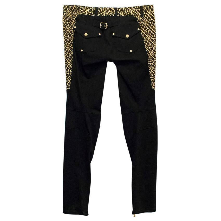 Balmain black, low rise, skinny jeans with ribbing on the thighs, gold ankle zips and gold embroidery on the outer thighs and around the waistline. 

Condition: 10/10

Approx measurement:
Waist: 41cm 
Outside Leg: 105cm 
Inside Leg: