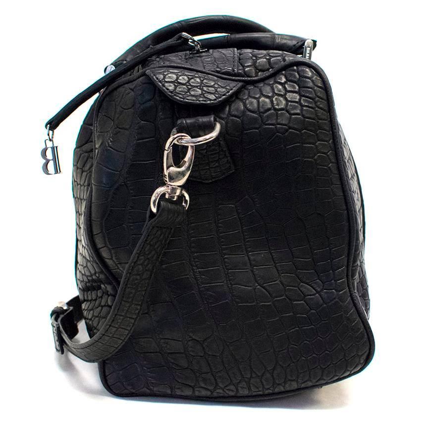 Balmain medium sized black crocodile skin soft tote bag. It features silver hardware, two top handles, an optional shoulder strap and a top zip. The interior is fully lined with leather and has one main compartment with size pockets. 

Postage