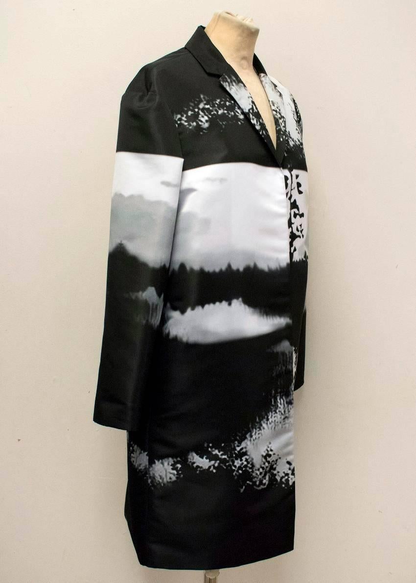 Mary Katrantzou black, white, and grey printed coat. This coat features a collar, long sleeves, and a silver inner lining. There are pockets on each side. 

Condition: 10/10

Approx measurements:
Bust: 52.5cm 
Waist: 53.5cm 
Length: 93cm