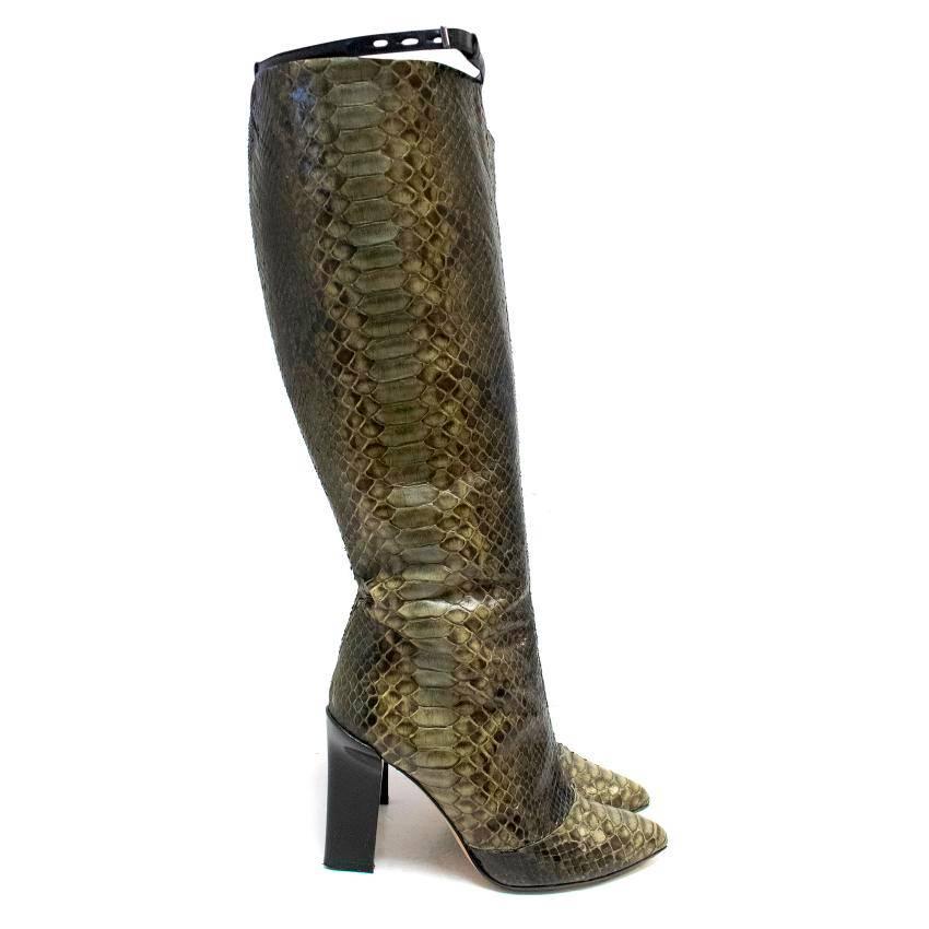 Reed Krakoff python leathe high-heeled tall boots with pointed toes, zips on the in-side and an ankle strap with a metal buckle. 

There are some signs of wear of the soles and the heels, otherwise the shoes are in good condition.

Condition: 9.5/10