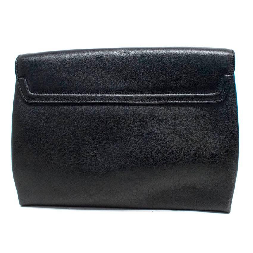 Tom Ford leather calf grained black clutch with a large gold zip, flap closure and interior zipper pocket. 

Conditions Details : Some marks on the back of the clutch.
9.5/10

Approx measurements: Width: 32 Cm Height: 25 Cm Depth: 23 Cm