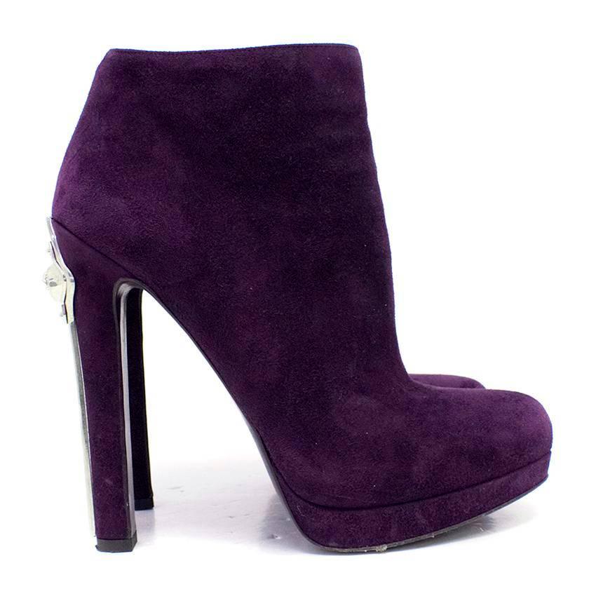 Alexander McQueen purple suede heeled ankle boots on a platform featuring a silver toned metal detail on the heel. 

Fasten on the in-side with a concealed zip.

Lined with purple leather.

Conditions Details : There is normal wear to the soles,