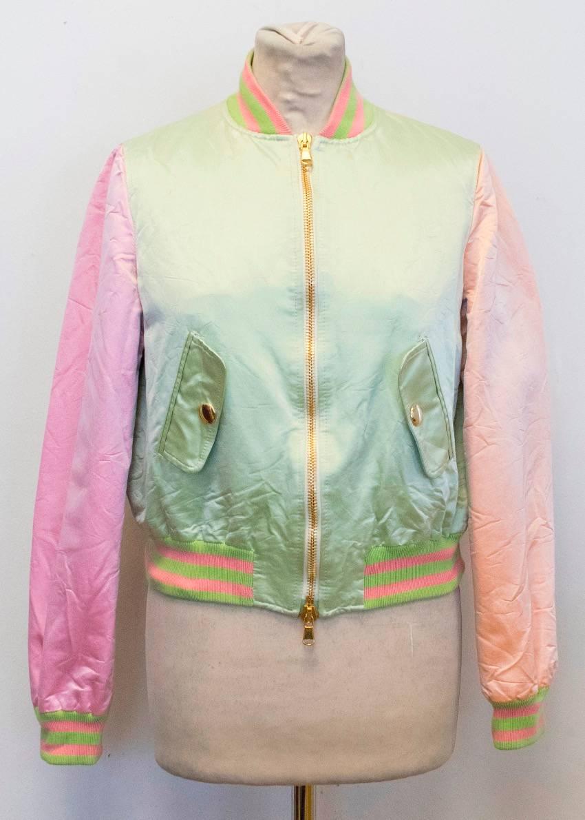 Moschino CheapandChic green, pink and peach, pearlized fabric, lightweight, bomber jacket.

This item belongs to Meg Matthews. 

Conditions Details : Very minimal wear on the stitching on the back of the left sleeve. 
9.5/10

Approx measurements: