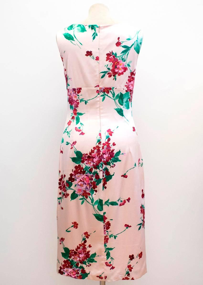 Dolce & Gabbana pink silk stretch dress. 
This item features floral prints, with functioning pearl buttons and a back zip closure. 100% Silk.

Label size: 42
UK 10
US 6

Condition: 9/10
Some minor signs of wear on the dress, but overall great