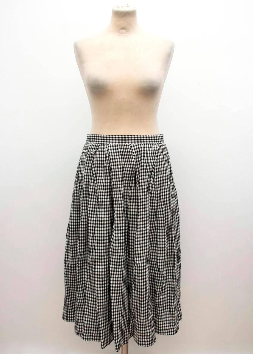 Comme des Garçons check skirt and coat in a matching monochrome set. The skirt is high-waisted in a full pleated midi style. The coat is a lightweight knee-length duster with a feminine neck tie.

Approx:

Skirt:
Waist - 36cm
Length -