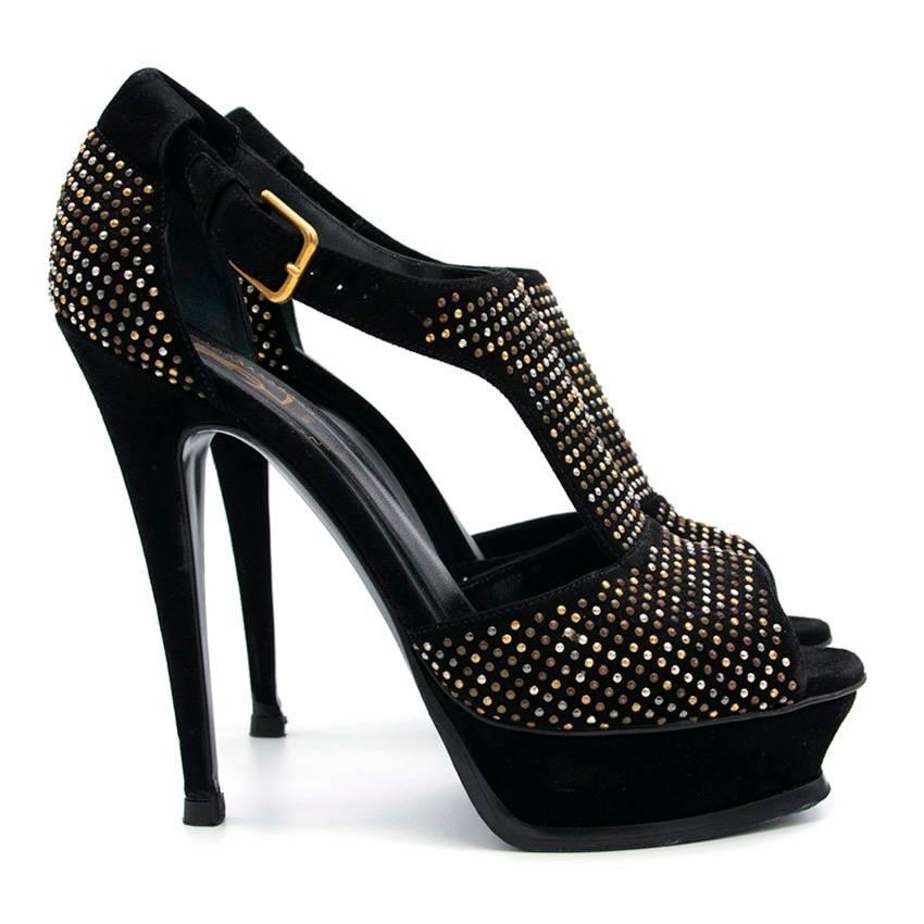 Yves Saint Laurent black suede platform sandals with gold and silver metal studs. Ankle strap buckle fastening. 

This item belongs to Caroline Stanbury from Ladies of London 

Conditions Details : 9.5/10

Signs of wear to heel, please refer to
