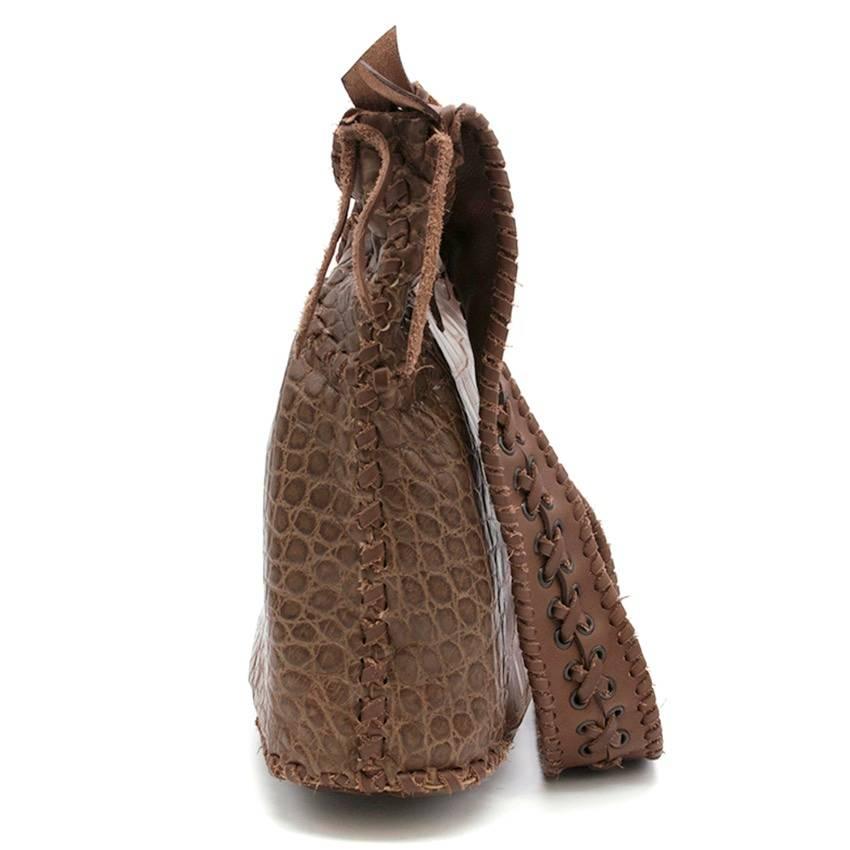 Balmain Aventura brown crocodile leather shoulder bag with cross lace detail on strap, 3 compartments and zip closure.

Condition: 9.5/10  

Fabric: Crocodile Leather
Approx Measurements: Length- 25cm, Width- 43cm

UK Size: One Size
US Size: One
