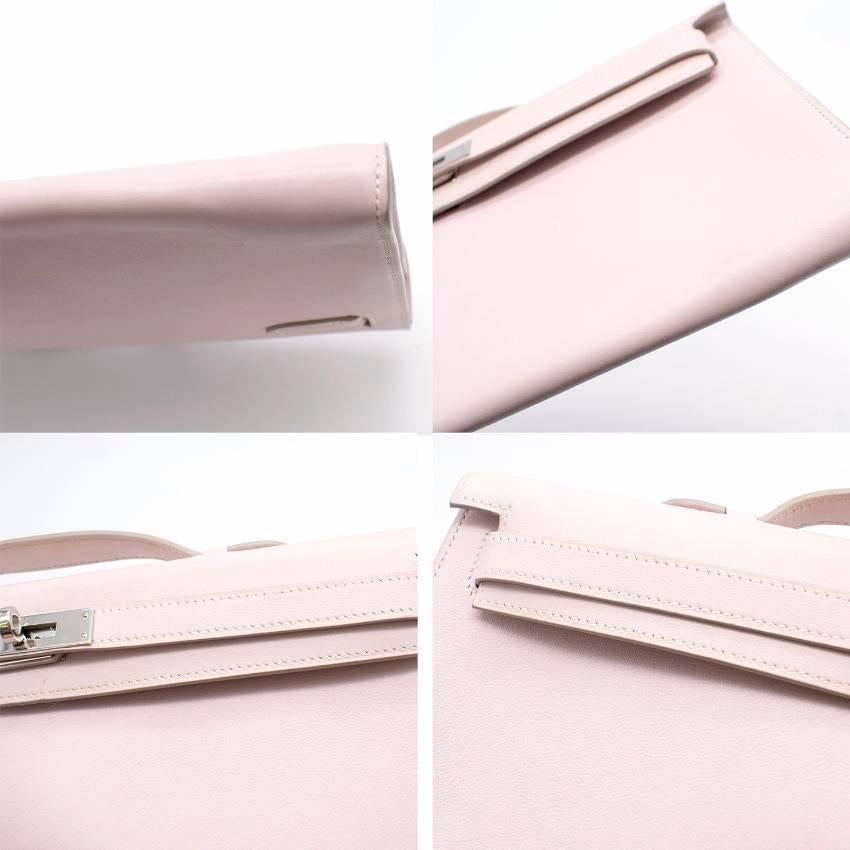 Hermes Kelly Cut Longue Pochette Bag.
Made in France.  

In swift glycine. 
Features tab closures. 
Includes a small interior pouch. 
Date stamp: K in a square. 

Fabric: Leather/Silver Palladium Hardware. 
Colour: Glycine, a shade of lavender.