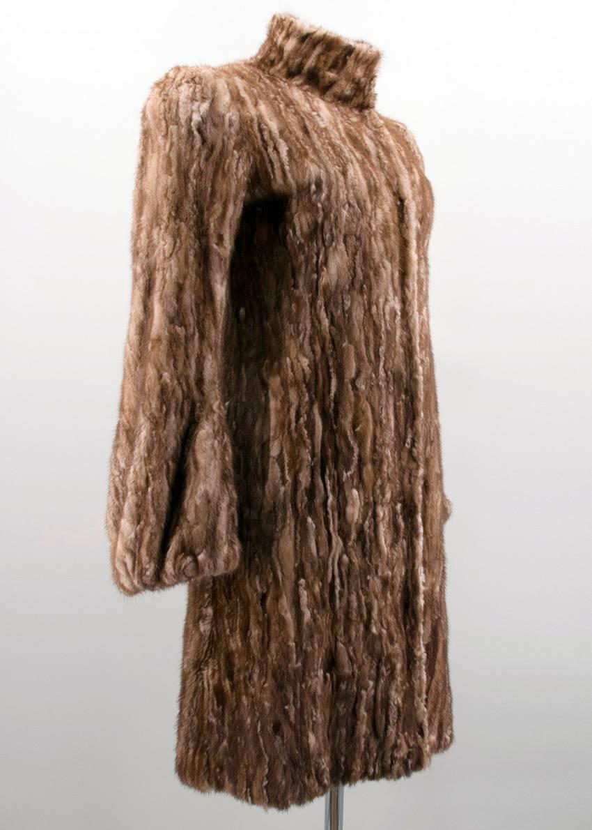Prada brown mink fur coat with silk insert detailing, high neckline, structured shoulders, two slit pockets, silk lining, long silhouette and concealed hook and eye closure. 
Made in Italy.

UK Size: Size 38/Small 
US Size: Small 

Fabric: Dyed