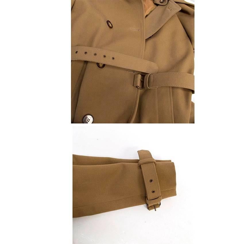 Khaki trench coat with a detachable collar, belt and belt detailing on the cuff. 

Good condition with one small faded mark on the front near the bottom. This can be seen with the zoom in in image 10- 8.5/10. Please note, the coat is quite