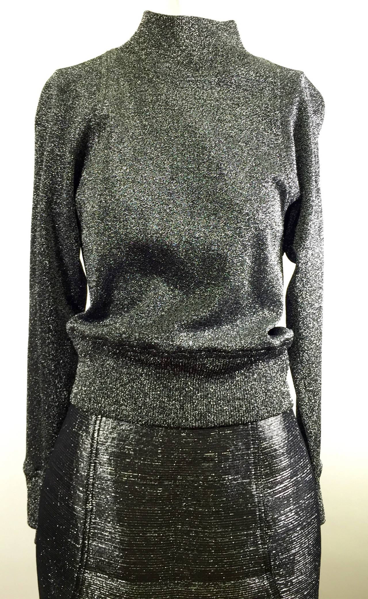 This is a rare Charles Jourdan Paris Silver Sweater & pencil Skirt
Made in France
Size 38

Measurement:
Sweater Top  65% cupro 35% polyester 
bust 34