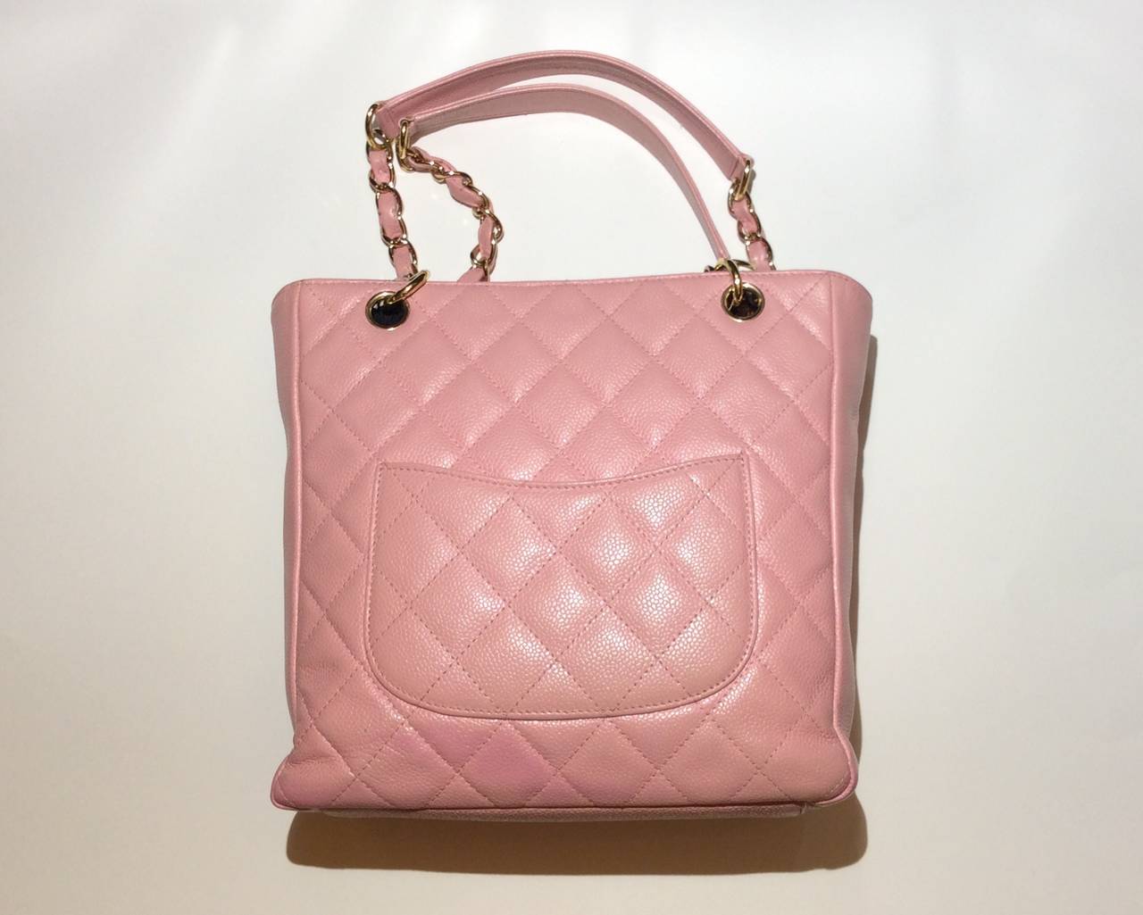 This is a sweet Chanel petite shopper with pink quilted caviar leather tote with 2 shoulder straps and gold hardware.
Measurements:
10