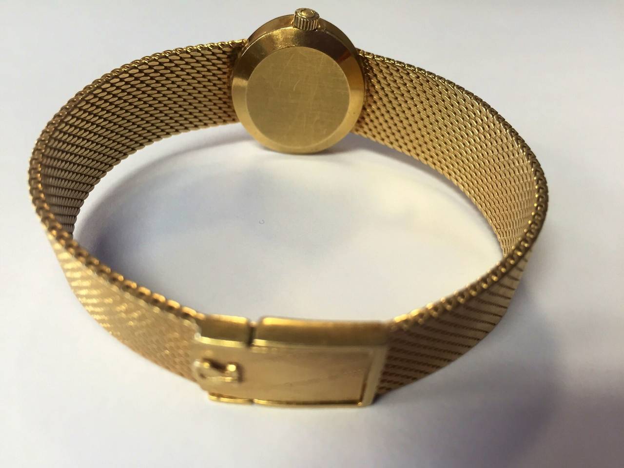 This gorgeous and rare Omega DeVille lady's watch is solid 18kt. 
Swiss Made, 7