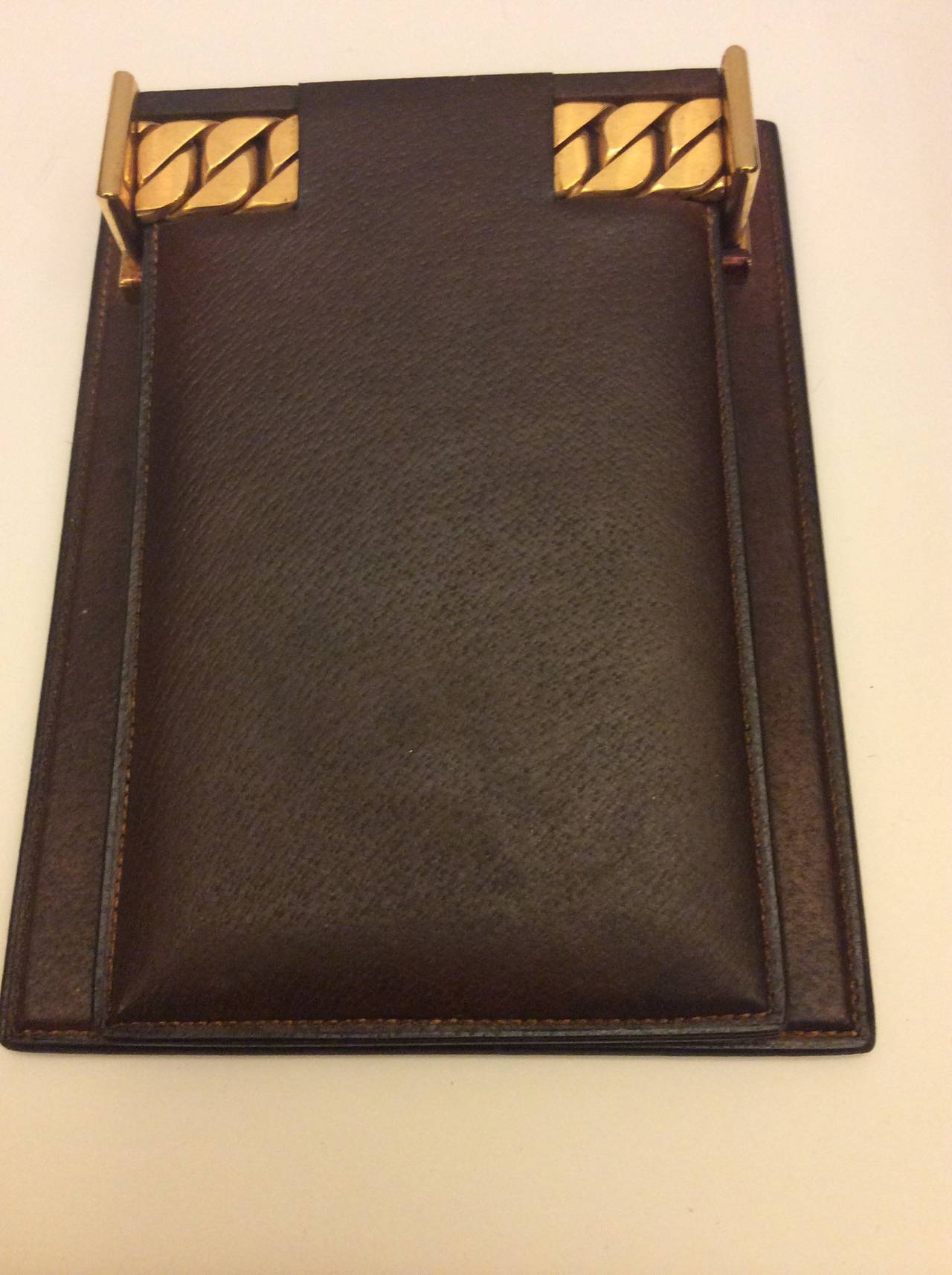 This is a vintage Gucci brown leather Paper-tray and notepad holder with heavy gold chain detail.