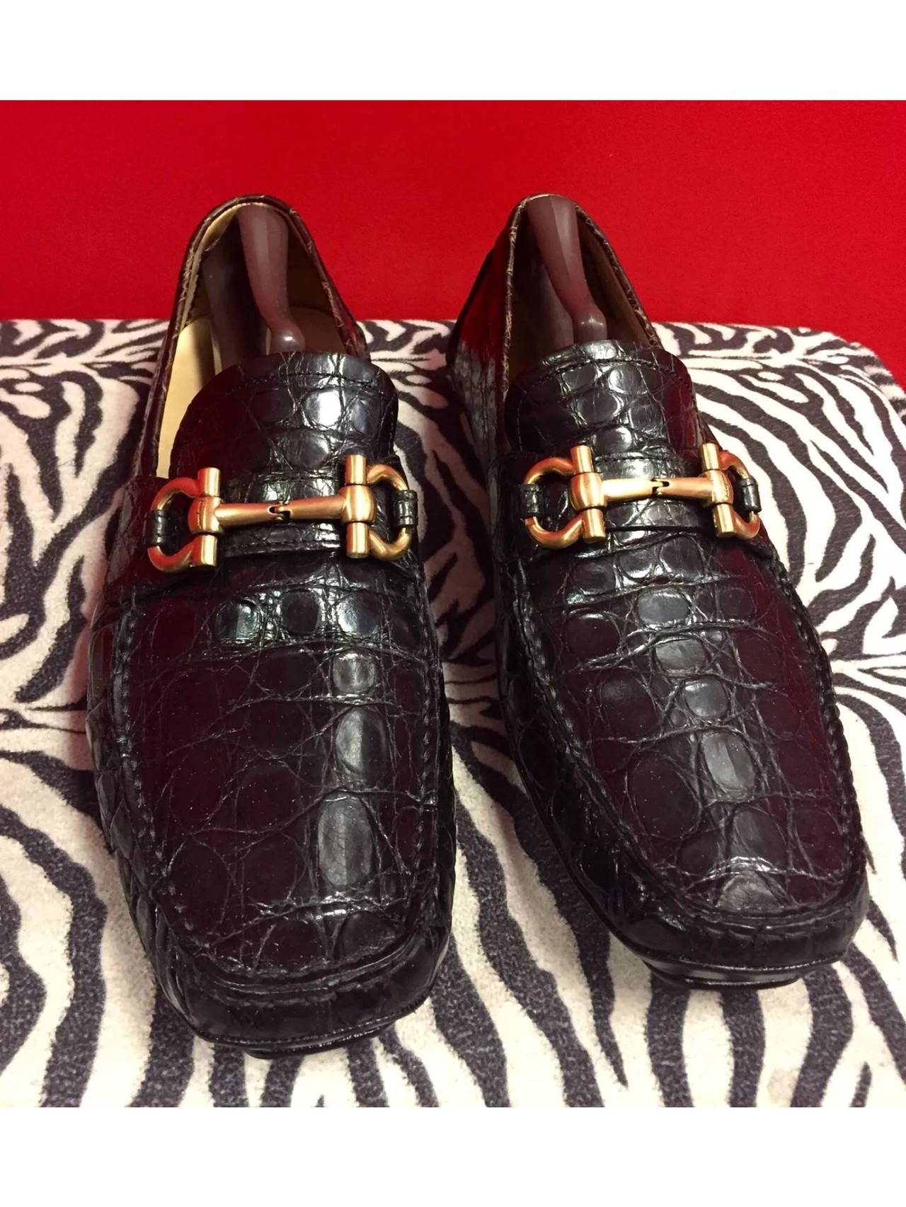 These are a pair of Salvatore Ferragamo Black Crocodile Loafers Matte Gold Gancio bit Slip On style. 
They are in excellent condition!