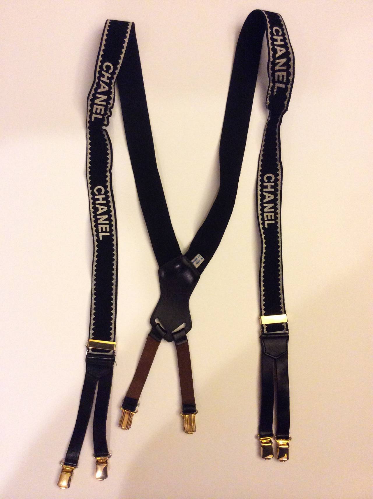 These are a rare iconic Chanel suspenders with elastic and leather straps with gold metal clips. Made in France. Adjustable length.