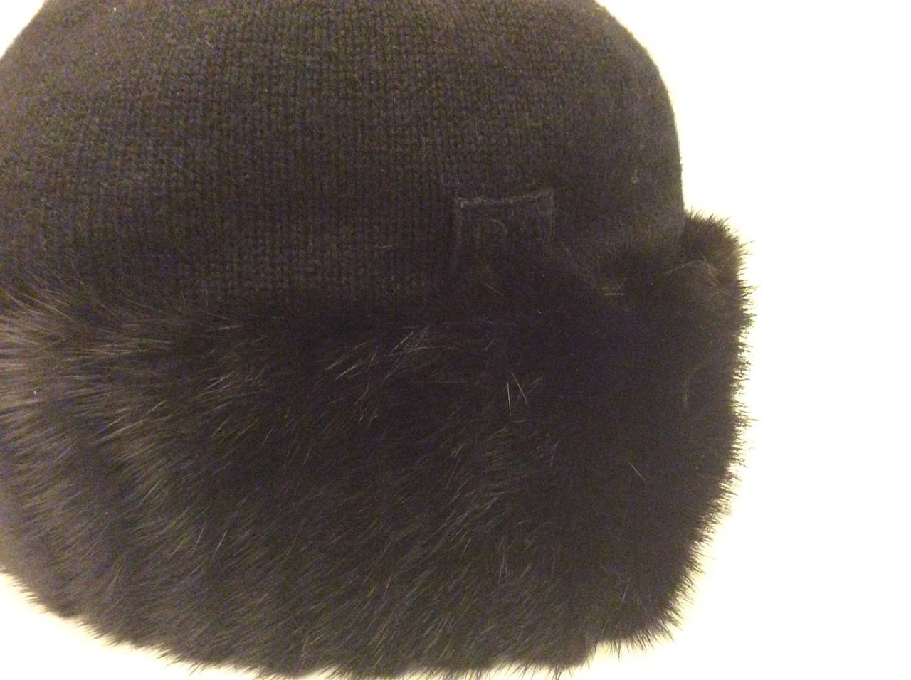 This is a magnificent Christian Dior black cashmere cap with mink trim.
Size medium