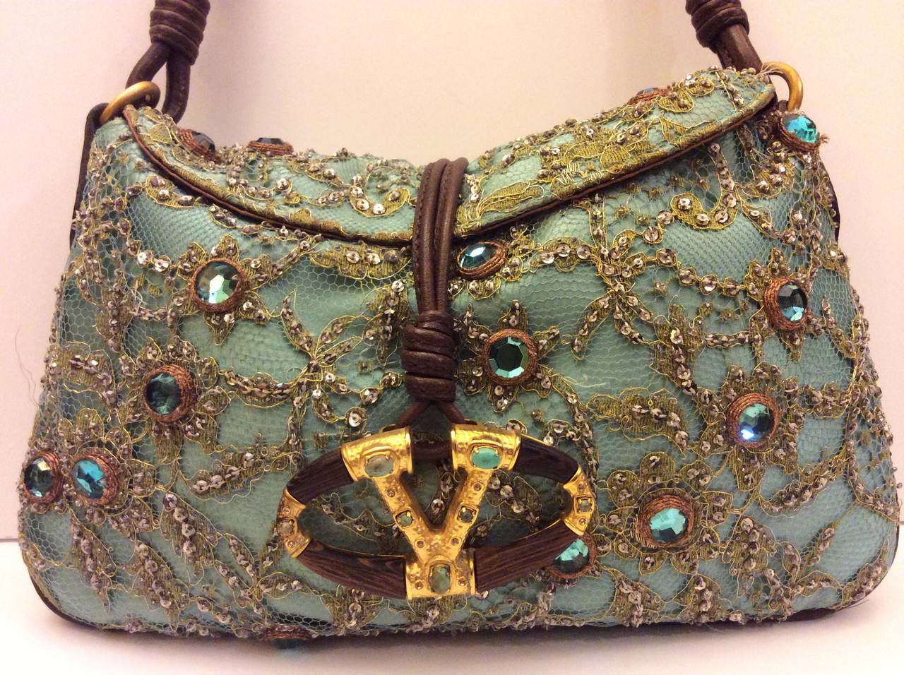 This is an absolutely stunning Valentino Garavani sequins and crystal encrusted lace over seafoam green silk and brown leather trim with double leather shoulder straps.
Made in Italy
Measurements:
Length 12
