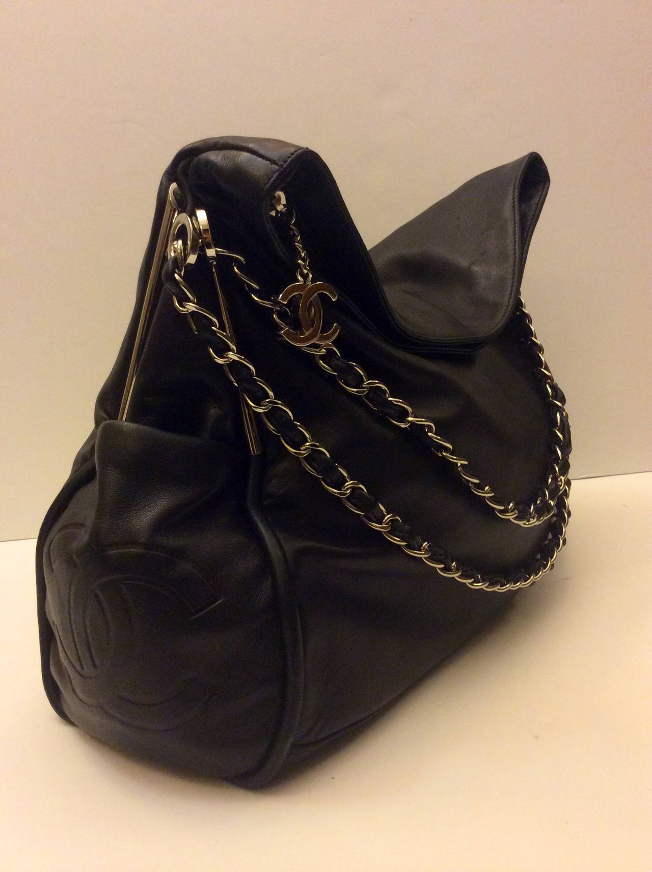 This is a Chanel soft lambskin hobo bag.  Ultimate Soft Line. Super soft black lambskin exterior. Beautiful double silver chain. The top of the bag folds over for that great slouchy look.  Chanel CC logo fabric lining. All silver hardware.  CC logo