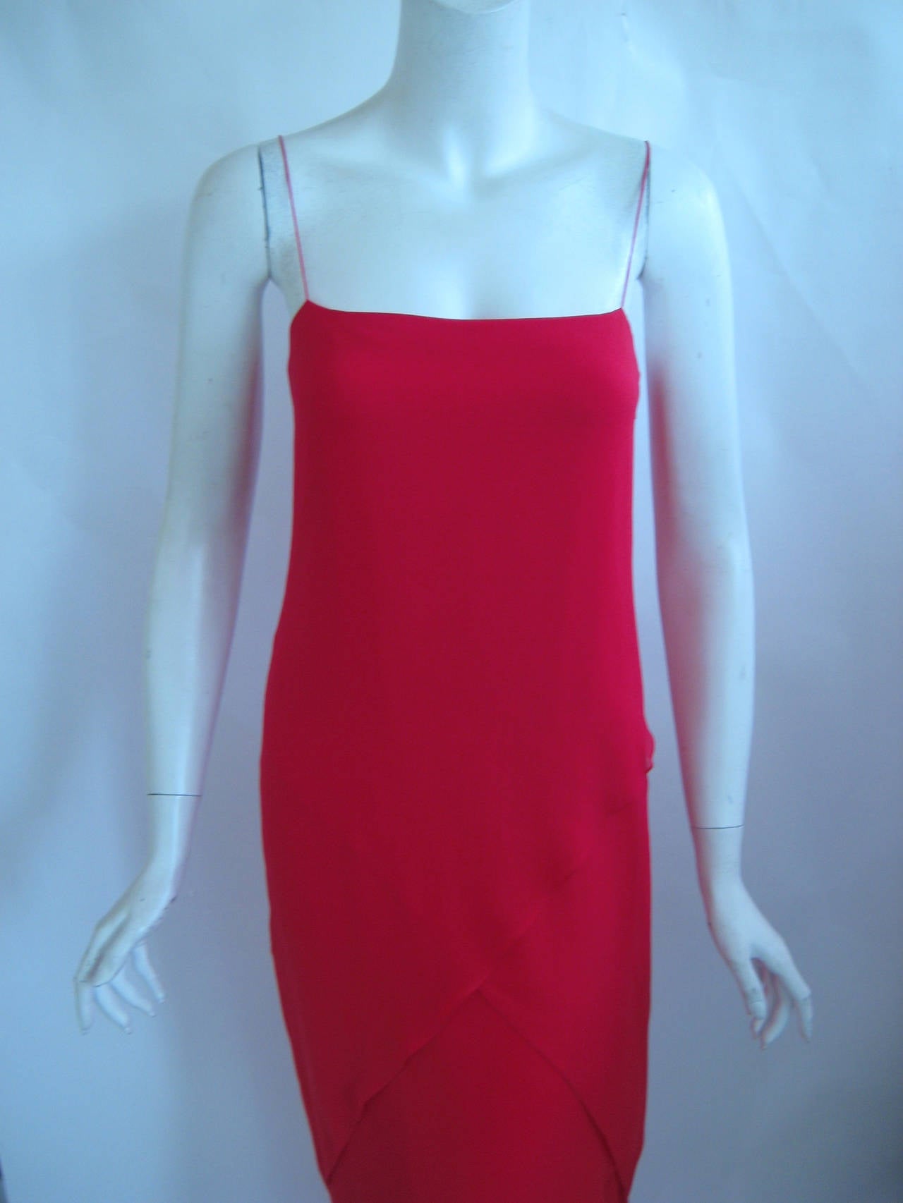 Get ready for Valentines day in they 1970s Bill Blass gown made up of layers of asymmetrical silk chiffon .This has a high low hemline and spaghetti straps.There 5 layers of silk chiffon layered in differing lengths over a silk crepe underslip .This