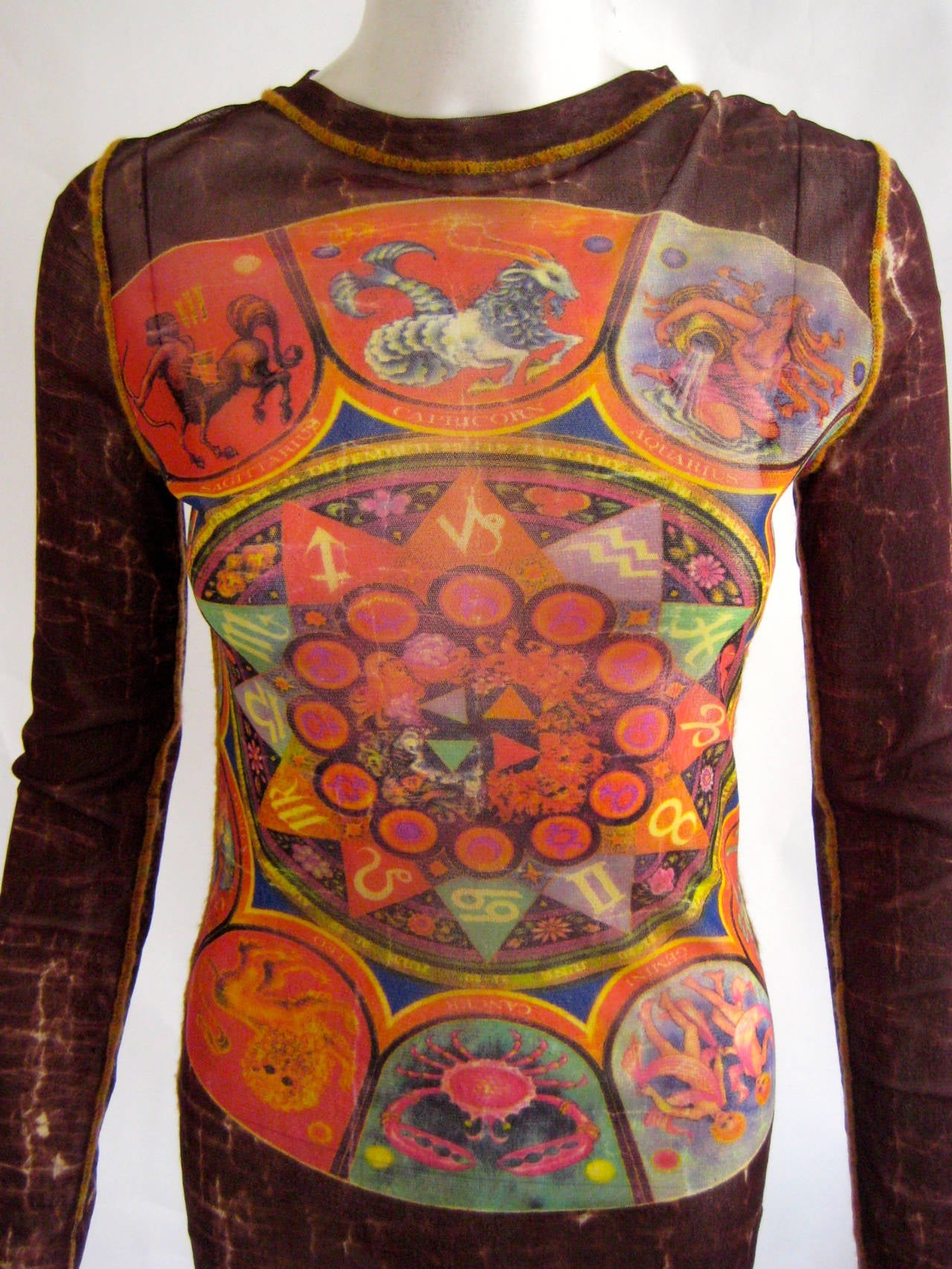 Vintage Gaultier mesh top printed with signs of the zodiac.Labeled size large but shown on a size 6 mannequin .Excellent condition