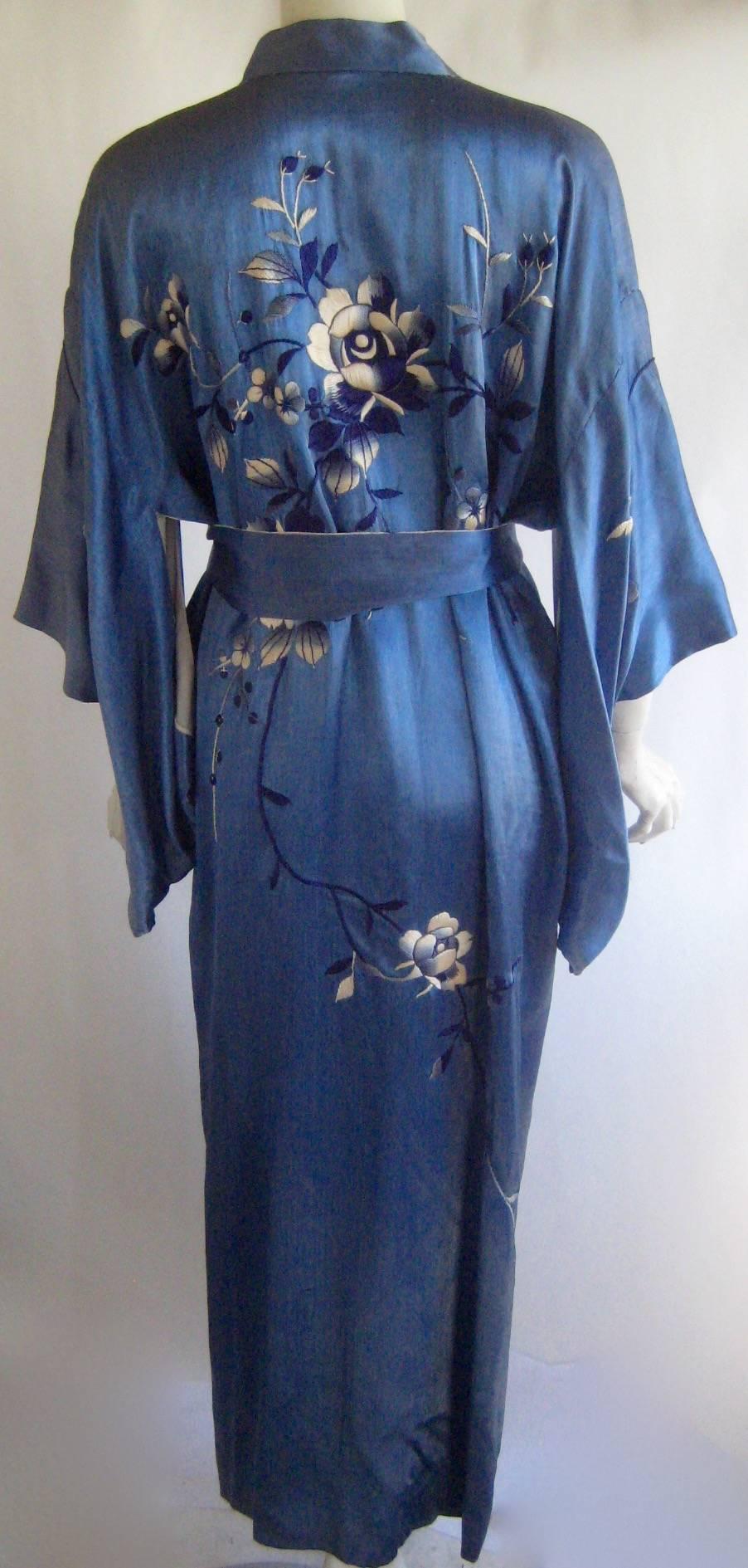 Amazing 1920s japanese art deco export kimono
Made for the american market 
Hand emboidered 
This is made of silk or a very high quality rayon silk blend 
Matching sash 
Fully lined in white
Excellent condition , very strong and wearable with