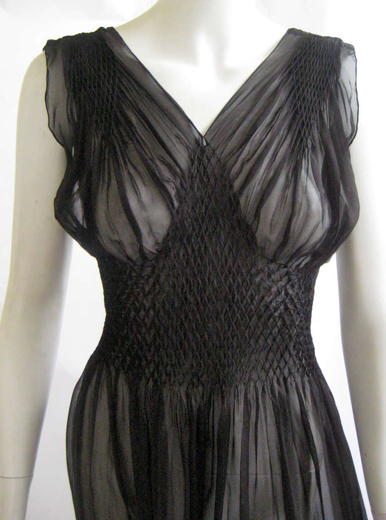 Rare and unusual lingerie dress that dates to the late 1930s or early 1940s
Semi sheer rayon silk chiffon
Hand smocked at waist and shoulders
No closures