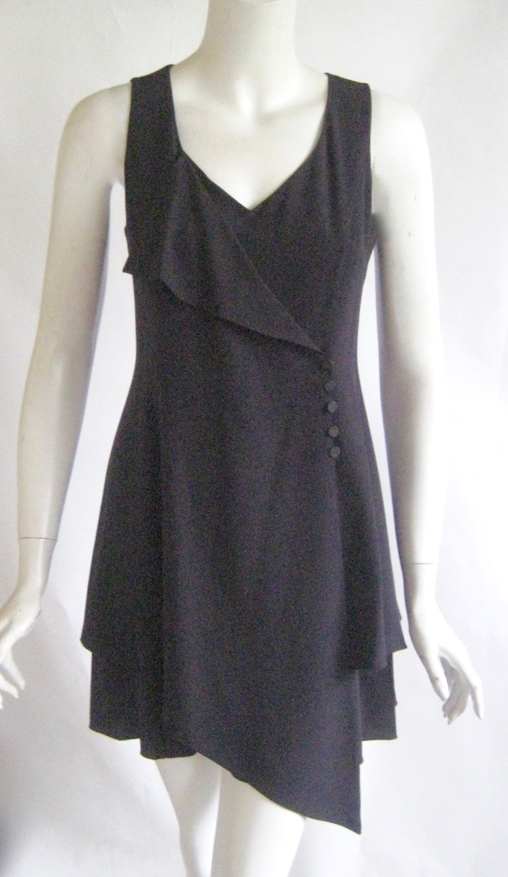 Love;y little black dress
100% silk 
Zipper up the back 
Buttons up the front 
Excellent condition 
Size 38