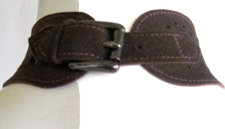 YSL suede choker with cutouts 
This fastens with a buckle in the back.This is i 1/2 
