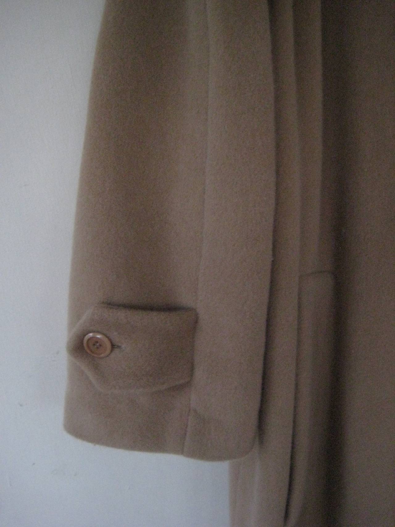 Lucious Moschino coat in a modified 1950s cut 
Slight swing at bottom
2 side slash pockets
Button down front with a hidden placket
Soft  cashmere lined in rayon silk blend, this feels wonderful on
Fabric tags have been removed