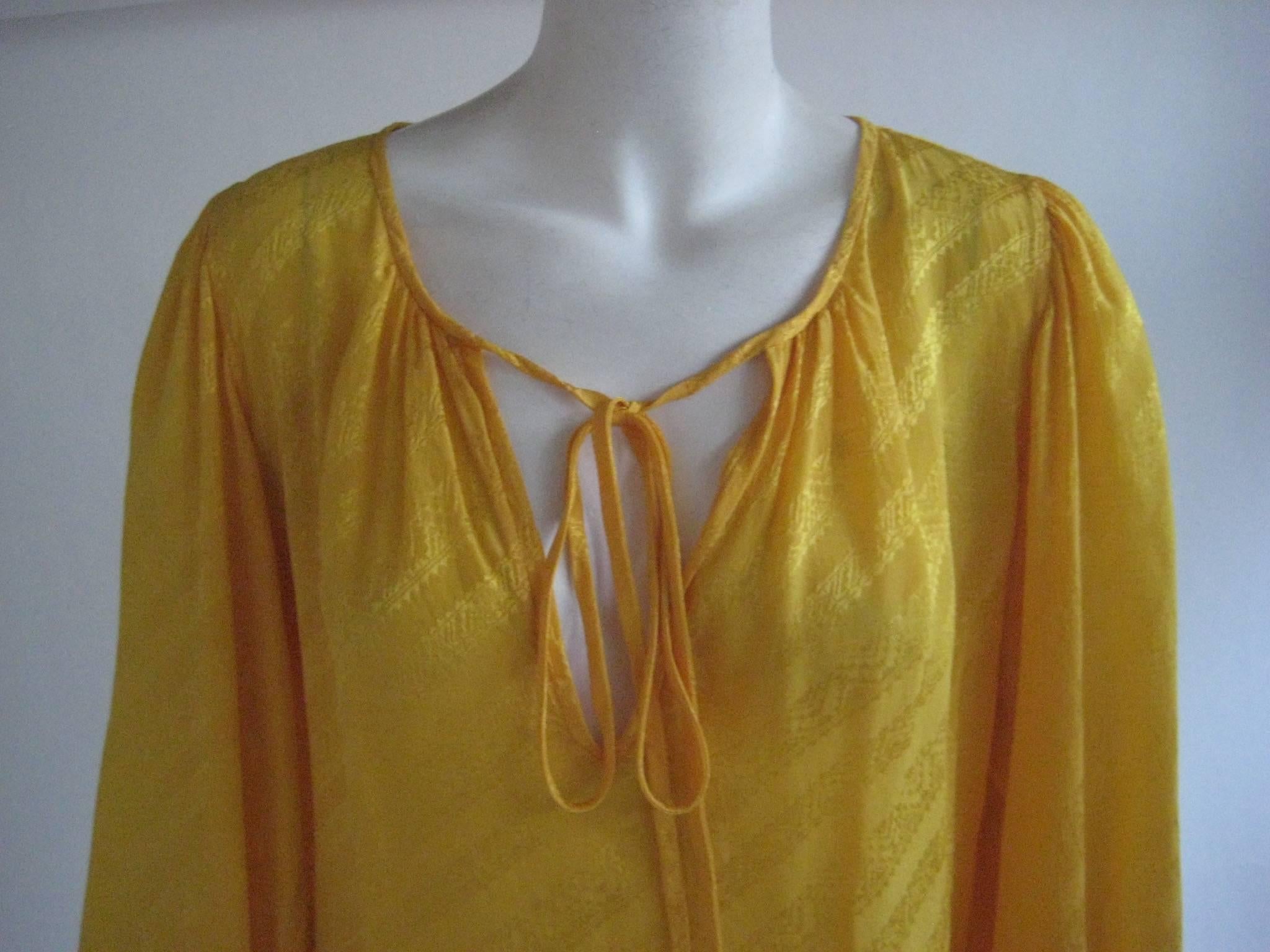 Lovely Yves Saint Laurent Peasant Blouse 
Ties in front 
Button cuffs 
100% silk