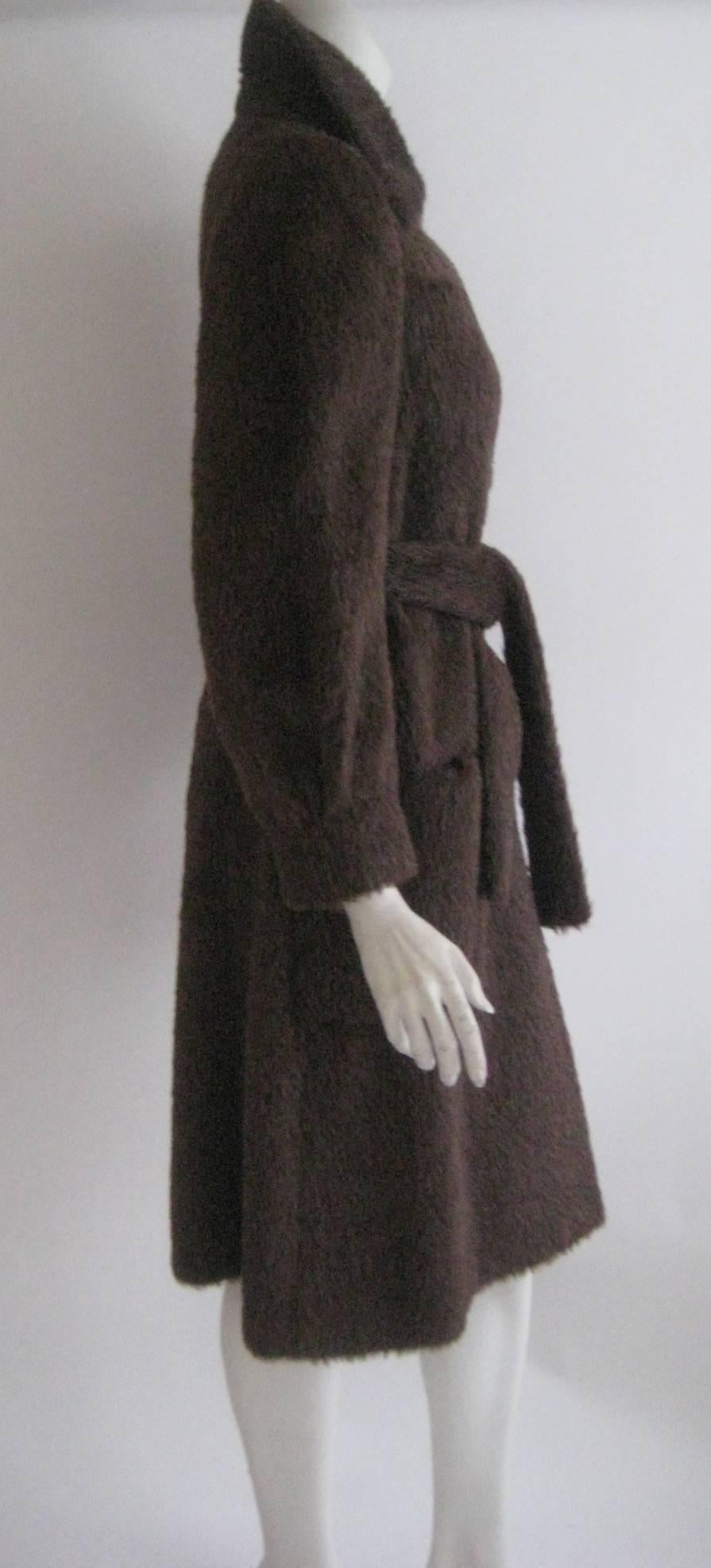 Lovely Norell Mohair wrap coat 
4 small front patch pockets
Matching sash belt
Button down front
Lined in brown silk