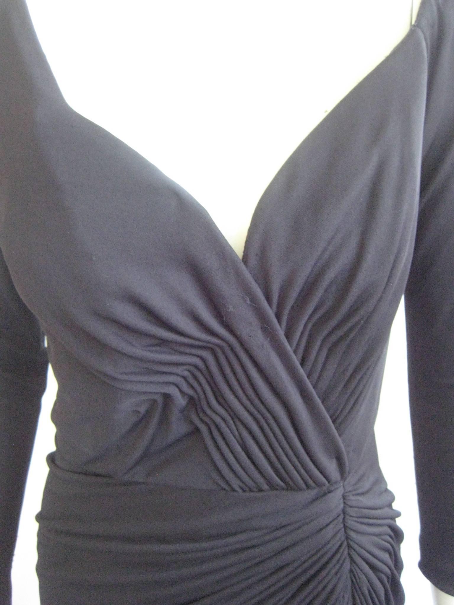 Amazing vintage Vicky Tiel couture cocktail evening gown
Shirred bodice
Zipper up the back
Long slit up the front
36 -26 36 length 53
100% rayon jersey knit

