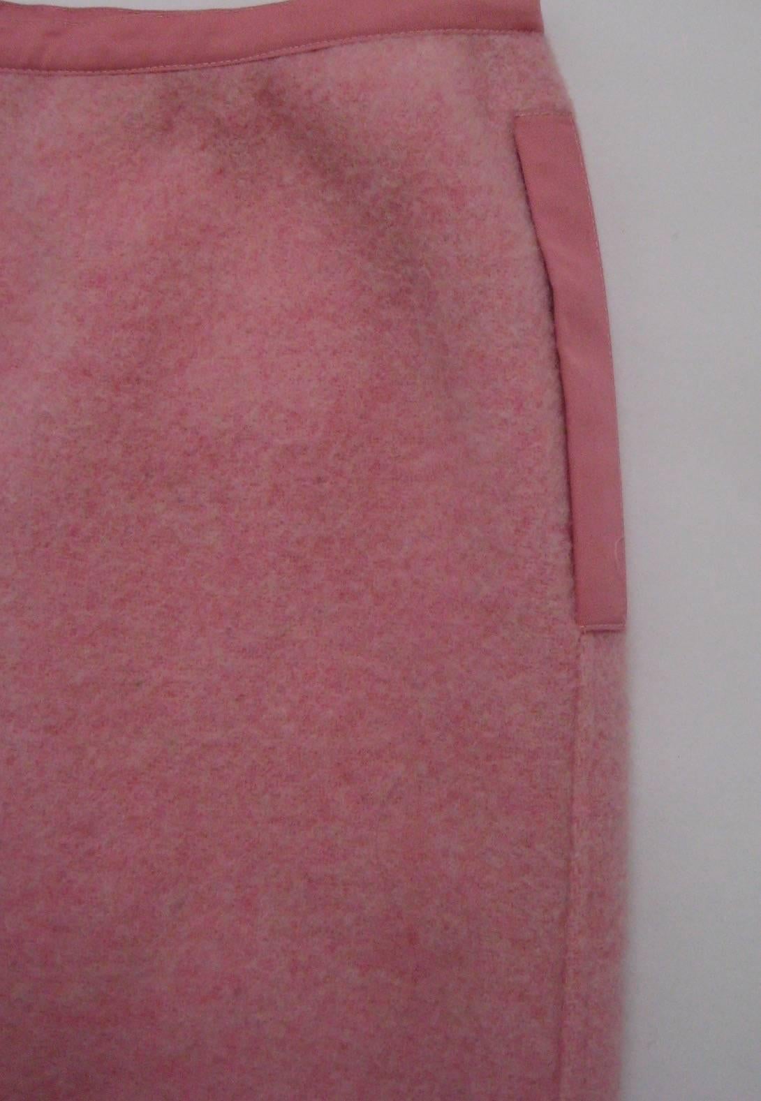 Lovely Courreges skirt in a wool knit with just a touch of mohair 
Fully lined 
Side front zip hidden under ribbon detail
2 side pockets
Near mint condition, this looks unworn