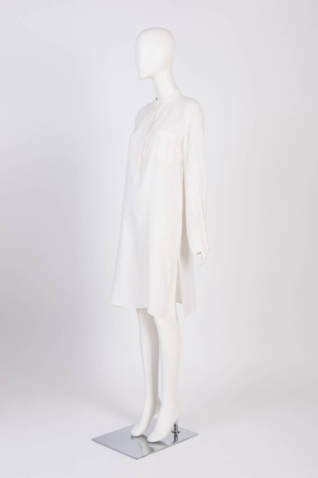 Kurta-style shirt dress with patch pockets and side slits in lightweight linen blend.