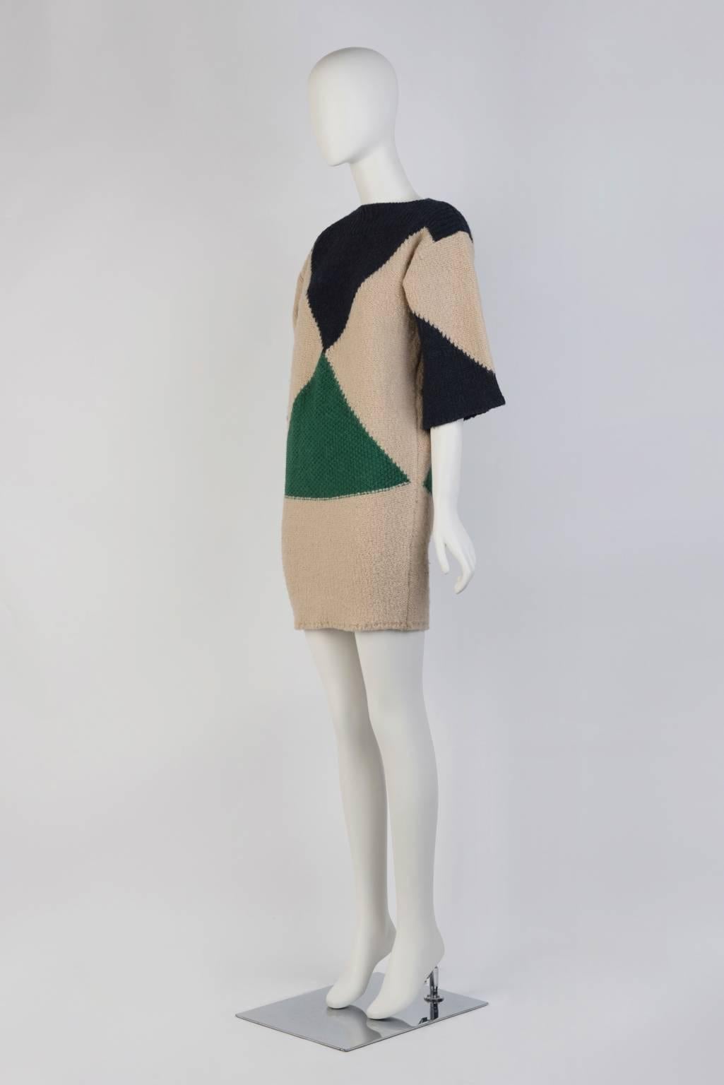 Triangle print, heavy knit mini dress with 3/4 length sleeve.