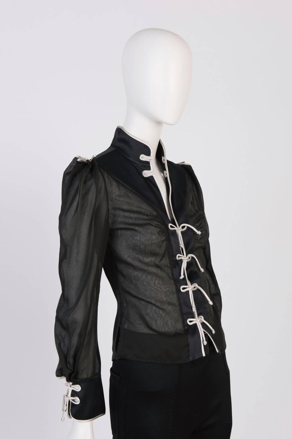 Chinoiserie-victorian style Yves Saint Laurent blouse featuring oriental collar, cuffs and fasterning. Fitted at waist and slightly puffed at shoulder. Organza body with satin pipings.