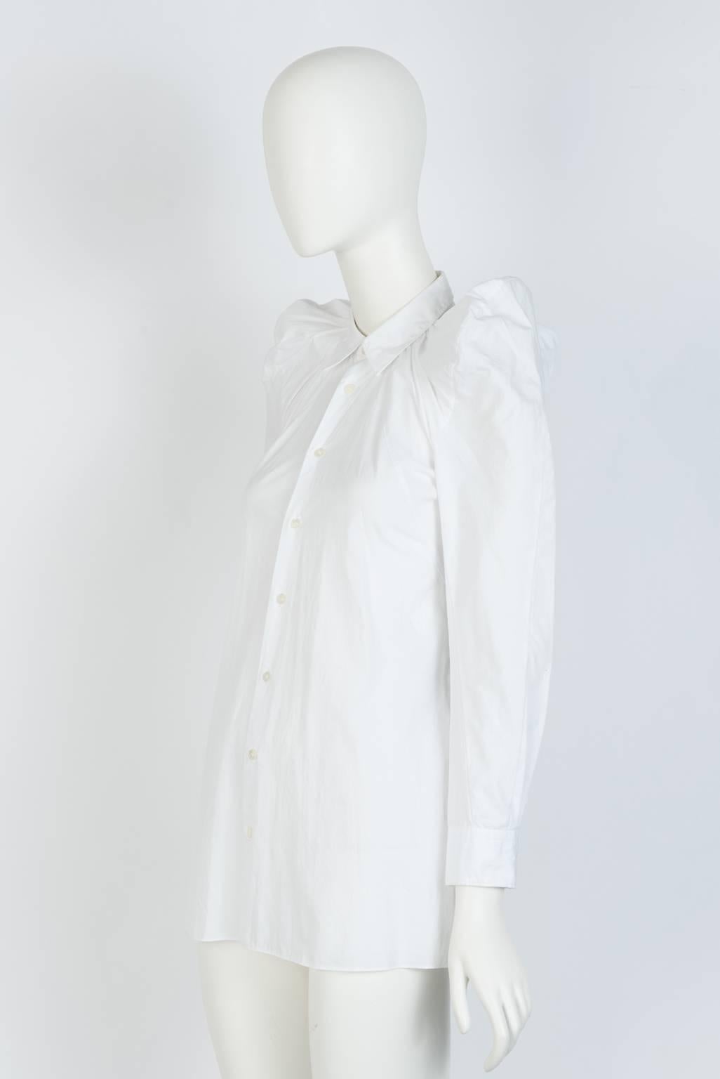 From Junya Watanabe 2009 Collection, this cotton fiited shirt features a gathered neckline, creating an exaggerarted shoulder with a tuxedo back design.