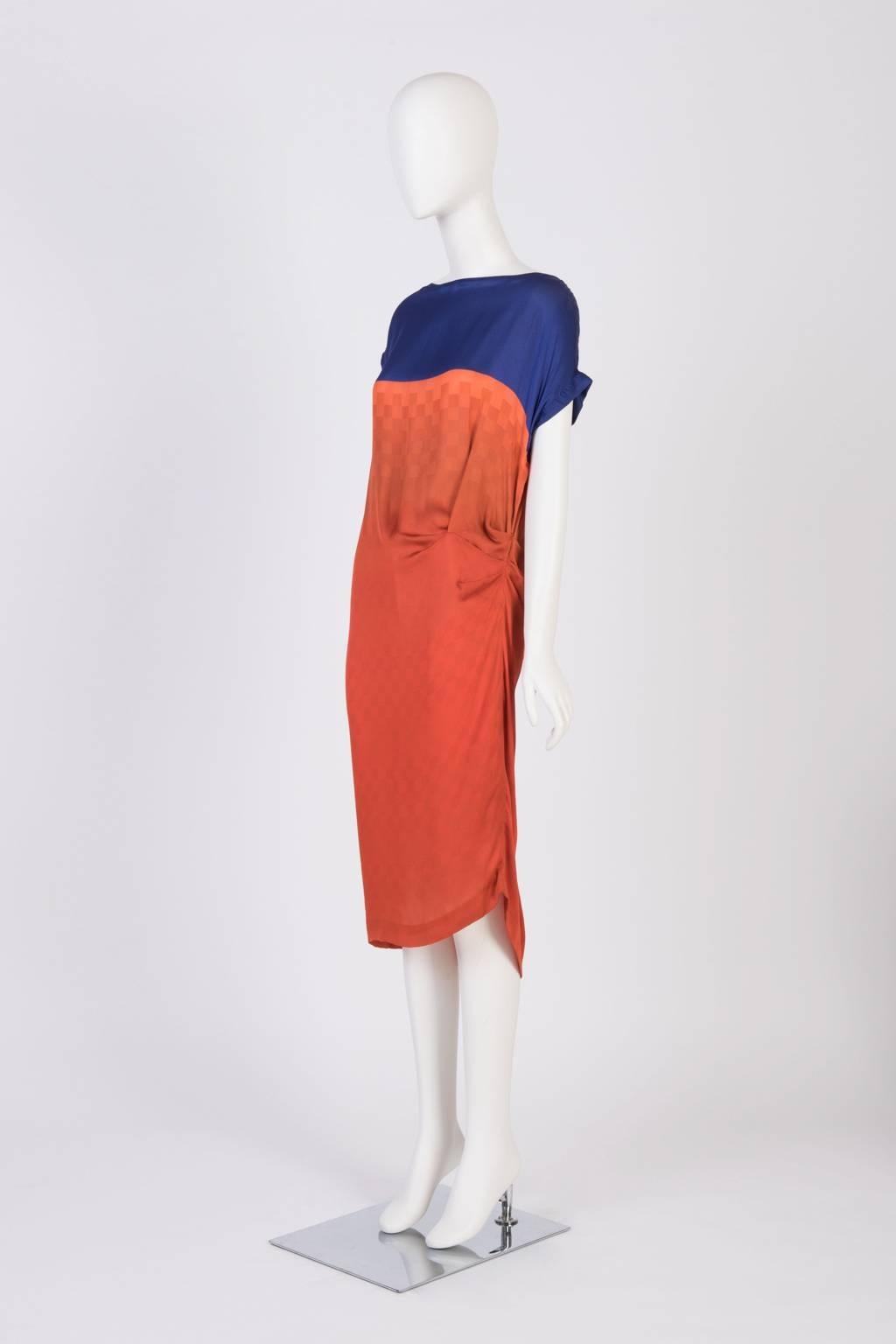 Dries Van Noten loose fit bias cut silk dress in color blocking print with cap sleeves. Subtle check details on print.   