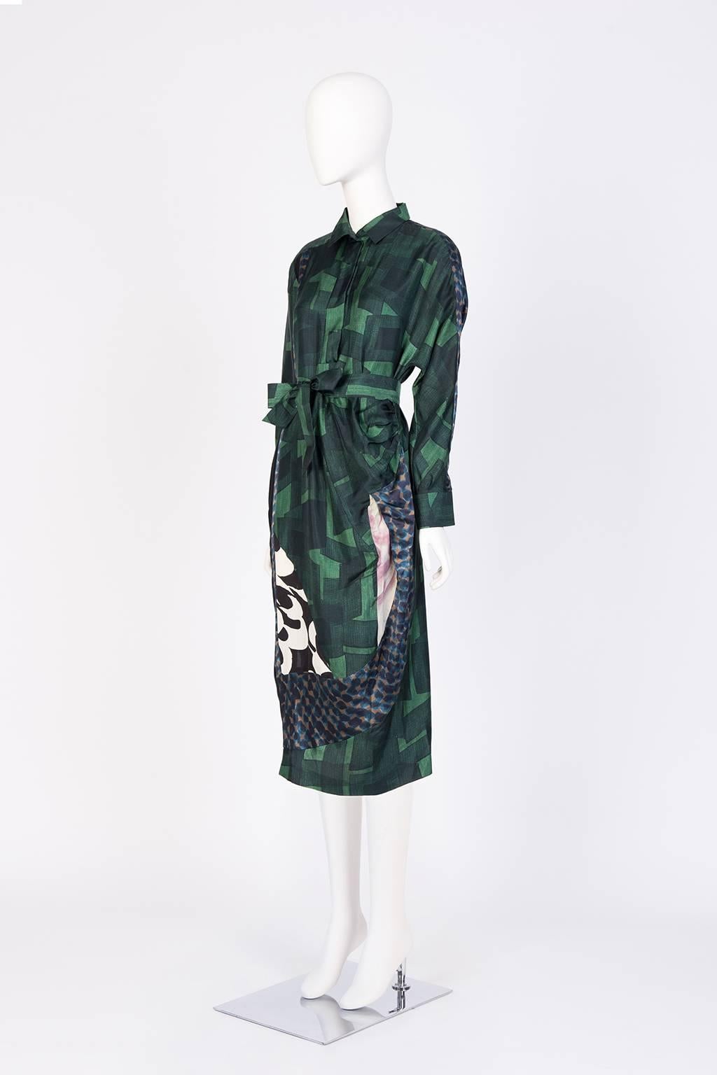 Loose asymetrically pleated silk shirt dress with various textured print panels. 
