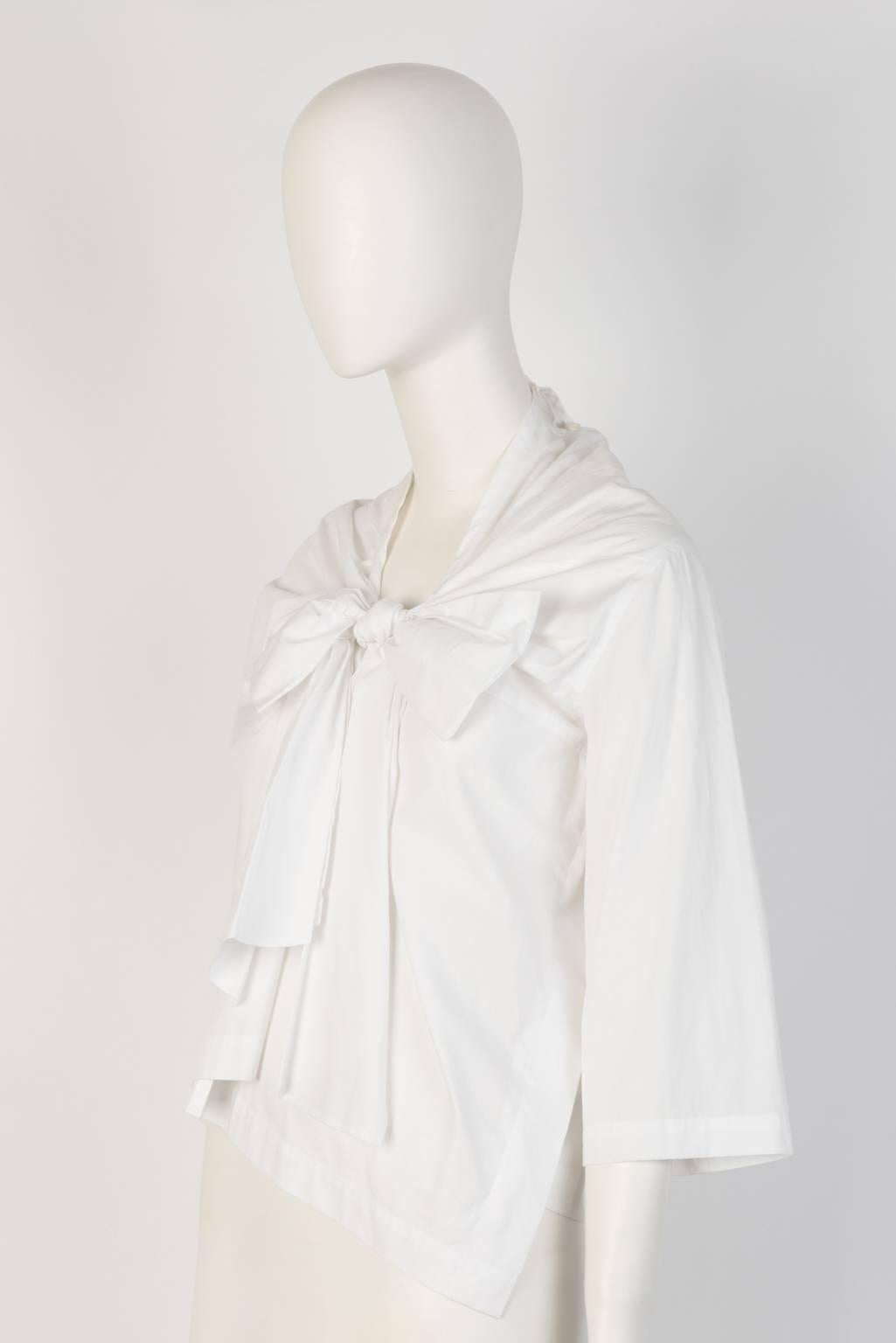 White cotton three quarter sleeve top with gathered big bow tie design in front. From 2013 tricot COMME DES GARÇONS collection. 