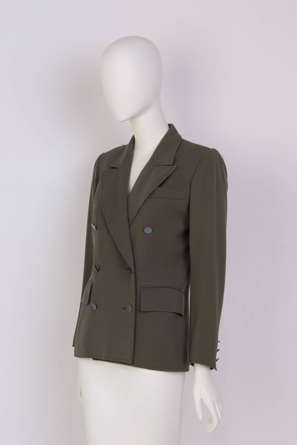 Double breasted jacket in olive wool twill. Fully Lined with shoulder pads. 