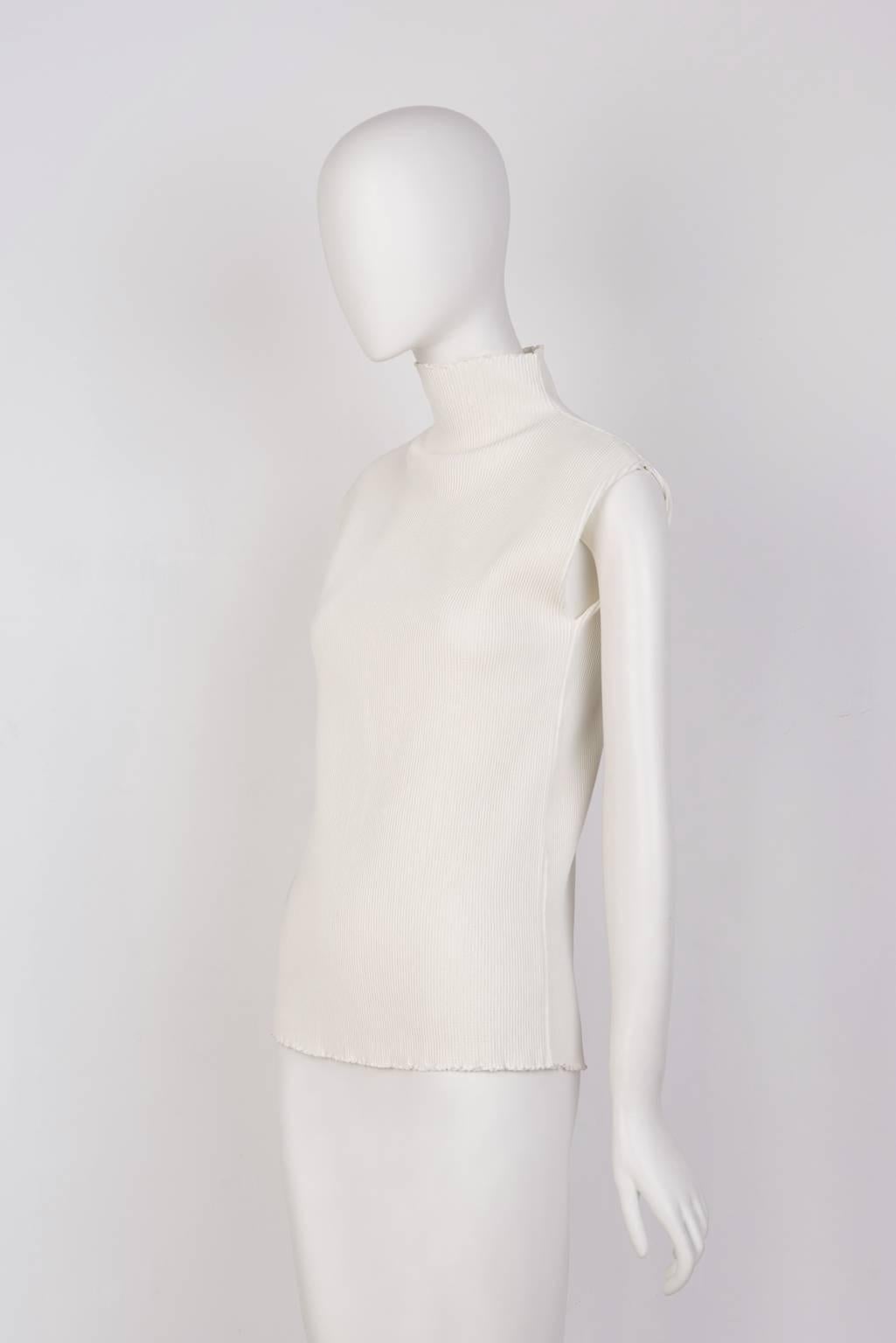  Sleeveless turtleneck in  ribbed, knit blend.