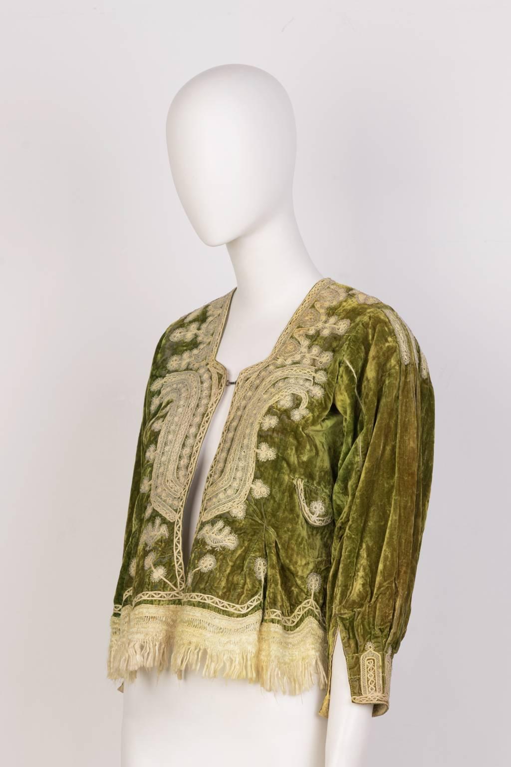 Medium green, crushed velvet A line top with pale gold emroidery and fringe. 